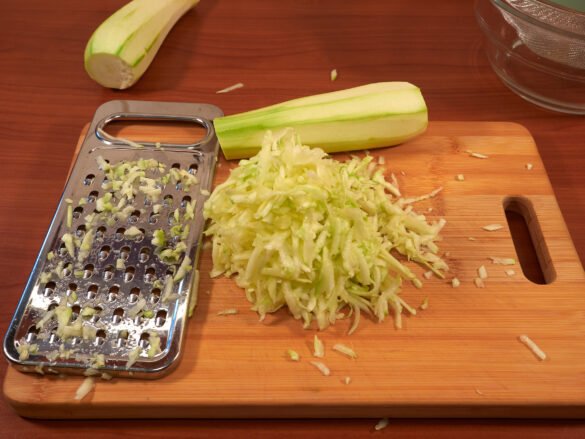 Grating Zucchini for Ham and Cheese Rolls